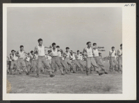 [recto] Sparring routine. Japanese-American recruits are shown in routine army setting up exercises. The 442nd combat team at Camp Shelby is ...