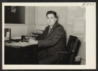 [recto] Ray Grow, Reports Officer of the Chicago Area Office. ;  Photographer: Mace, Charles E. ;  Chicago, Illinois.