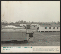 [recto] Trailer and barrack type quarters provided at the Lomita Housing Project near Lomita, California, which are being used by returnees while they locate permanent homes in the area. ;  Photographer: Parker, Tom ;  Lomita, California.