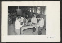 [recto] The boys of 9A in shop class. Yataka Ito, teacher. ;  Photographer: Parker, Tom ;  McGehee, Arkansas.