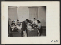 [recto] An interior view of the Office Service Section headed by J. S. Jancock. ;  Photographer: Parker, Tom ;  Denson, Arkansas.