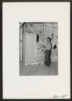 [recto] Tule Lake, Newell, Calif.--Shinkichi Kiyono, 56, evacuee from Longview, Washington, exhibits the cabinet which won for him first prize (a carpenter's plane) in a furniture building contest. All pieces of furniture were made from scrap lumber. ;  Photogr