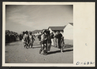 [recto] A few of the evacuees who participated in the Harvest Festival Parade held at the Gila River center on Thanksgiving day. ;  Photographer: Stewart, Francis ;  Rivers, Arizona.