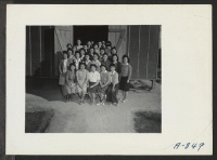 [recto] A group picture of the sewing school. ;  Photographer: Stewart, Francis ;  Poston, Arizona.