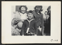 [recto] Byron, Calif.--Youngsters in this family of Japanese ancestry, from a farm in Contra Costa County, await bus for assembly center ...