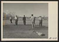 [recto] Golfing enthusiasts enjoy a friendly game of golf at Manzanar Golf Course. These golfers, and other fellow evacuees, when clearing ...