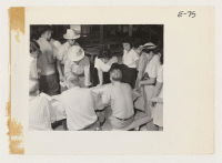 [recto] First contingent workers volunteers for tasks necessary in preparing the center for later arrivals. They came from Merced Assembly Center, Merced, California. ;  Photographer: Parker, Tom ;  Amache, Colorado.