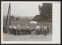 [recto] The Missouri River bottom lands produce choice cantaloupes. Some producers, such as the Hellwig Brothers, ship the melons in their own trucks. Other farmers prefer to sell direct to the consumer from roadside stands, as shown here. ;  Photographer: Mace