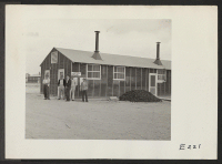 [recto] The exterior of the Internal Security Office and the Housing Department in rear. ;  Photographer: Parker, Tom ;  Denson, Arkansas.