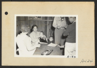[recto] Poston, Ariz.--Evacuees of Japanese ancestry are given a preliminary medical examination upon arrival at this War Relocation Authority center. ;  Photographer: Clark, Fred ;  Poston, Arizona.