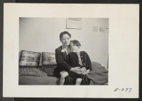 [recto] A mother and daughter who are living at this relocation center. The husband and father is in an internment camp. ;  Photographer: Parker, Tom ;  Denson, Arkansas.
