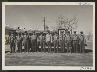 [recto] Members of the Manzanar Fire Department are shown posed in front of their fire truck. ;  Photographer: Stewart, Francis ;  Manzanar, California.