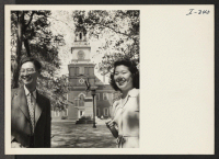 [recto] Hiroshi Uyehara, from the Rohwer Relocation Center, and Fuku Yokoyama, from Colorado River, are walking though the tree-shaded square behind Independence Hall in Philadelphia, Pennsylvania, where they have just seen the famous Liberty Bell. ;  Photograp