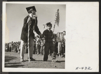 [recto] Great originality in costume designs was shown at the Harvest Festival Parade which was held at this relocation center. ;  Photographer: Stewart, Francis ;  Newell, California.