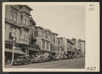 [recto] View of business district on Post Street in a neighborhood occupied by residents of Japanese ancestry, before evacuation. Evacuees will be housed in War Relocation Authority centers for duration. ;  Photographer: Lange, Dorothea ;  San Francisco, Cali