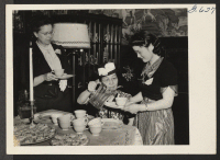 [recto] At a monthly tea for New York City resettlers at the Japanese Methodist Church in uptown Manhattan, Mrs. S. Iijima, ...