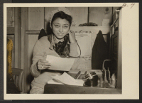 [recto] Office and other workers are given opportunities to follow their callings at War Relocation Authority centers for evacuees of Japanese ancestry. Trudes Osajima, (above), switchboard operator in the Administration building. ;  Photographer: Albers, Clem
