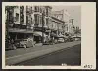 [recto] Los Angeles, Calif.--Street scene in Little Tokyo near the Los Angeles Civic Center, prior to evacuation of residents of Japanese ancestry. Evacuees will be assigned to War Relocation Authority centers for the duration. ;  Photographer: Albers, Clem