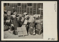 [recto] Eden, Idaho--Baggage, belonging to evacuees who have just arrived from the assembly center at Puyallup, Washington, is sorted and then trucked to their barrack apartments. ;  Photographer: Stewart, Francis ;  Hunt, Idaho.