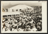 [recto] Large crowd assembled to bid bon voyage to residents of Poston who left the project by bus and truck August 24, 1943, for the Rivers center, on the first lap of the journey to Japan via the Gripsholm, which sailed from an eastern seaport Sept. 1. ;  Pho