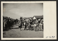 [recto] Evacuee participants who marched in the Harvest Festival Parade held at this center on Thanksgiving day. ;  Photographer: Stewart, Francis ;  Rivers, Arizona.