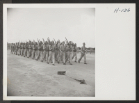 [recto] A division of the Japanese-American combat team passes in review. The 442nd combat team at Camp Shelby is composed entirely ...