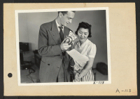 [recto] Poston, Ariz.--Florence Mori, evacuee of Japanese ancestry at this War Relocation Authority center, taking part in this CBS broadcast. Chet Huntley of the CBS is directing the program. ;  Photographer: Clark, Fred ;  Poston, Arizona.