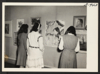 [recto] Students at the New Jersey College for Women, New Brunswick, New Jersey, view an exhibit of paintings and sculptures by ...
