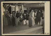 [recto] Manzanar, Calif.--Dancing for recreation at Manzanar reception center for evacuees of Japanese ancestry. ;  Photographer: Albers, Clem ;  Manzanar, California.