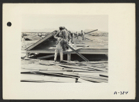 [recto] Poston, Ariz. (Site No. 3)--Barrack-living quarters being constructed for evacuees of Japanese ancestry at this War Relocation Authority Center. ;  Photographer: Clark, Fred ;  Poston, Arizona.