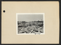 [recto] Poston, Ariz.--(Site #1)--Scrap lumber which will be put to many uses by evacuees of Japanese ancestry upon their arrival. ;  Photographer: Clark, Fred ;  Poston, Arizona.