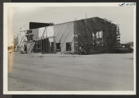 [recto] South front view of Canal Auditorium under construction. ;  Rivers, Arizona.