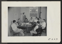 [recto] Paul A. Taylor, Project Director, holding a conference with newly elected members in his office. ;  Photographer: Parker, Tom ;  Denson, Arkansas.