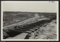 [recto] New flume across drain ditch in Section 10. ;  Photographer: Woodhull, Ray T. ;  Topaz, Utah.