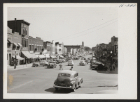 [recto] Saturday afternoon on main street in Lawrence, Kansas. Lawrence is typical of towns in the Midwest. ;  Photographer: Mace, Charles E. ;  Lawrence, Kansas.