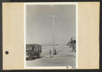 [recto] Poston, Ariz.--Site No. 2. High tension poles being installed at this War Relocation Authority center for evacuees of Japanese ancestry. ;  Photographer: Clark, Fred ;  Poston, Arizona.