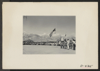 [recto] Manzanar, Calif.--Taps at Memorial Day services at Manzanar, a War Relocation Authority center for evacuees of Japanese ancestry. Boy Scouts and American Legion members participated in the services. ;  Photographer: Stewart, Francis ;  Manzanar, Calif