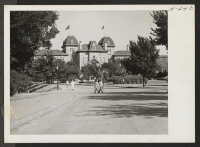[recto] Scene on the campus at Kansas State University at Lawrence, Kansas. ;  Photographer: Mace, Charles E. ;  Lawrence, Kansas.