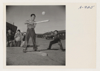 [recto] Sixth grade boys enjoy a game of softball at recess time. Note boys in rear who mistrust control of the speed ball pitcher. ;  Photographer: Stewart, Francis ;  Manzanar, California.