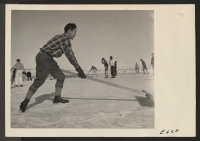[recto] Volunteer ice keepers maintain the ice rinks which have sprouted in many blocks at the Heart Mountain Relocation Center. Here, young former Californians of Japanese ancestry are learning what to them is a new sport. ;  Photographer: Parker, Tom ;  Hea