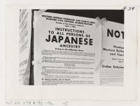[recto] Exclusion Order posted at First and Front Streets directing removal of persons of Japanese ancestry from the first San Francisco section to be affected by evacuation. Evacuees will be housed in War Relocation Authority centers for the duration. ;  Photo