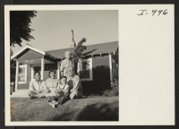 [recto] The heads of the Kishi families at Livingston, California, are seen on the lawn in front of the Chiyoko Kishi ...