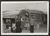 [recto] Former Tuleans on truck to be transported to their barracks.--INCOMING ;  Photographer: Aoyama, Bud ;  Heart Mountain, Wyoming.