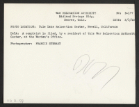 [verso] A complaint is filed, by a resident of this War Relocation Authority center, at the Warden's Office. ;  Photographer: Stewart, Francis ;  Newell, California.