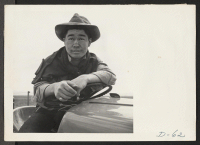 [recto] Tule Lake, Newell, Calif.--Jimmy Inahara, 24, farmer-evacuee from Stockton, California, operates a tractor on the farm at this War Relocation Authority center for evacuees of Japanese ancestry. ;  Photographer: Stewart, Francis ;  Newell, California.