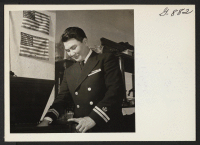 [recto] Lt. James Oda visits the Tasaka home in Washington while on leave from the Merchant Marine. Lt. Oda, from Honolulu, ...