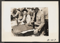 [recto] Arcadia, Calif.--All baggage is inspected before newcomers enter Santa Anita Park assembly center for evacuees of Japanese ancestry. Evacuees are transferred later to War Relocation Authority centers for the duration. ;  Photographer: Albers, Clem ;