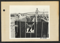 [recto] Poston, Ariz.--Barracks under construction at this War Relocation Authority center for evacuees of Japanese ancestry. Site No. 3. ;  Photographer: Clark, Fred ;  Poston, Arizona.
