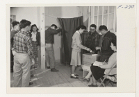 [recto] Residents of Block 14 casting ballots to elect a block manager. Similar elections were being held simultaneously in all blocks. ;  Photographer: Parker, Tom ;  Denson, Arkansas.