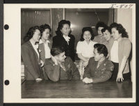 [recto] While visiting his war buddy, Pfc. Charles P. Carroll, 2102 S. Central Park, Chicago, Pfc. Noboru Hokame met some of ...